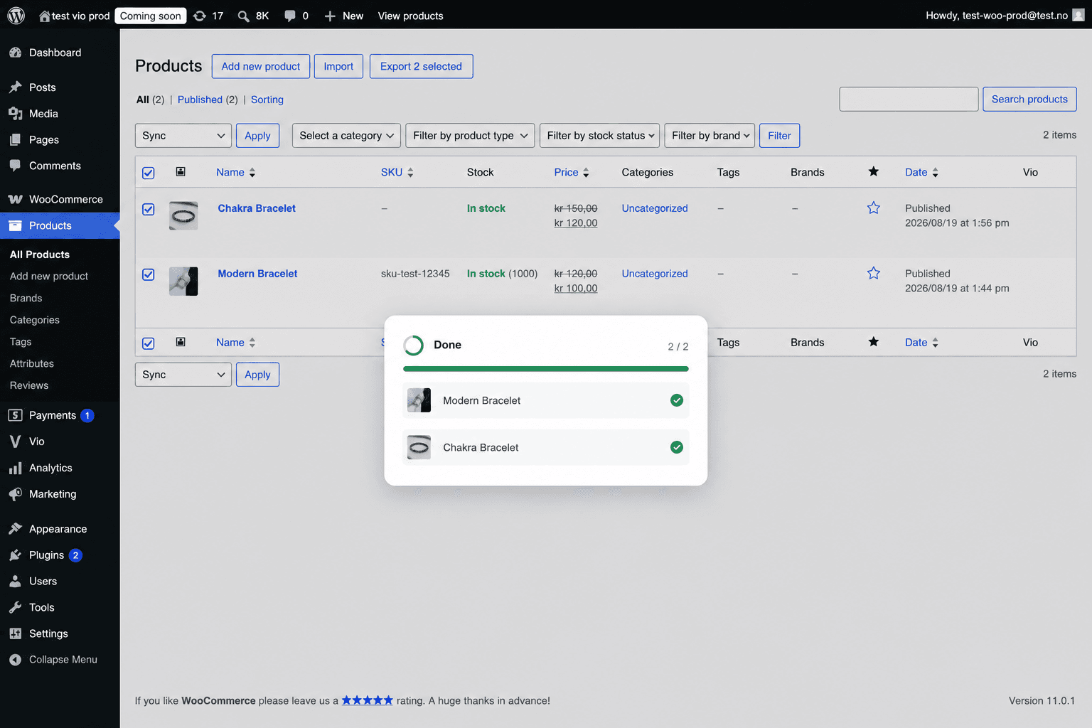The sync dialog — the progress bar full and each product marked with a green check (Done 2/2).